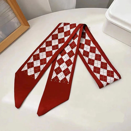 Red and white checkered scarf on a white surface